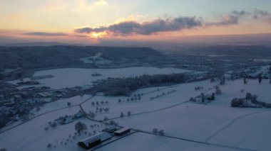 Great 4K aerial footage of a snowy forest viewed from a bird's eye view.