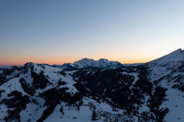 Wonderful scenery after a snow storm during a calm morning. The Swiss snowy landscape.