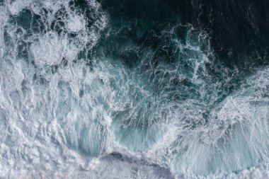 Huge waves crash off the coast of Madeira. With a drone from a bird's perspective.