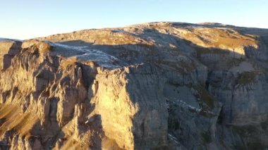 Great 4K aerial footage of a sunset in the canton of Glarus in Switzerland at the top of the pass called Klausenpasses.