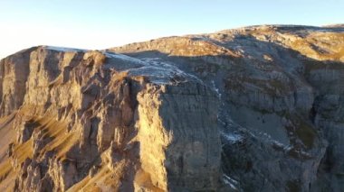 Great 4K aerial footage of a sunset in the canton of Glarus in Switzerland at the top of the pass called Klausenpasses.