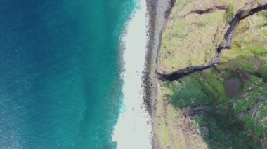 Epic flight over the ocean with views of water and land from above. Great video with big waves.