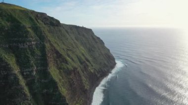 Beautiful flight over the cliffs of Madeira's coasts. The beautiful sides of Portugal's countryside.