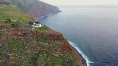 Beautiful sunset drone flight over Farol da Ponta do Pargo viewpoint in Madeira, Portugal.