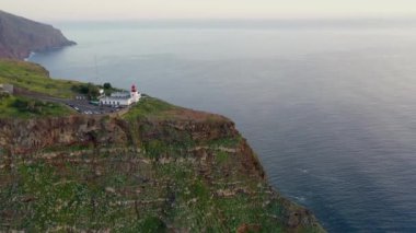 Beautiful sunset drone flight over Farol da Ponta do Pargo viewpoint in Madeira, Portugal.