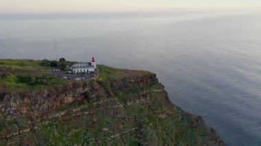 Beautiful sunset drone flight over Farol da Ponta do Pargo viewpoint in Madeira, Portugal.