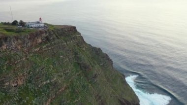 Beautiful sunset drone flight over Farol da Ponta do Pargo viewpoint in Madeira, Portugal.