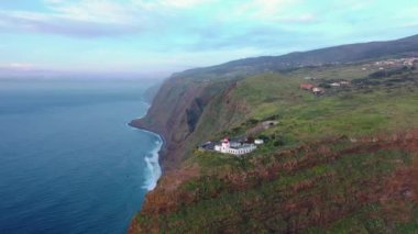 Beautiful sunset drone flight over Farol da Ponta do Pargo viewpoint in Madeira, Portugal.