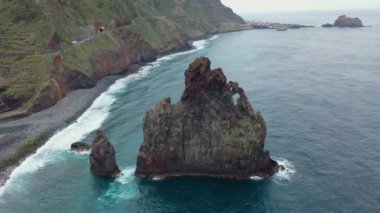 Great video with a drone around a rock on Madeira in Portugal called Ribeira da Janela.