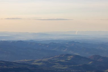 Beautiful colored horizon with red, orange and pink tones behind the mountains of Switzerland.
