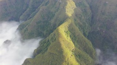 Wonderful flight over the Pica da Cana viewing platform in Madeira, Portugal. Various wind turbines can be seen in the background on the horizon.