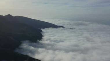 Wonderful flight over the Pica da Cana viewing platform in Madeira, Portugal. Various wind turbines can be seen in the background on the horizon.