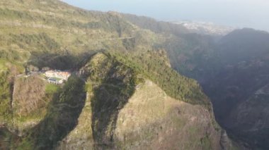 Epic aerial view over a canyon on the island of Madeira in Portugal. The trees thrive here very well because of the climate.
