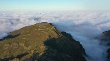 Gigantic drone aerial view over Pico Ruivo with a view of Pico do Arieiro during a beautiful sunset in 4K.