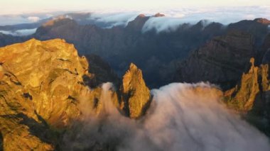 Great aerial footage in 4K of a sunrise in Madeira with an epic sea of fog between the peaks.