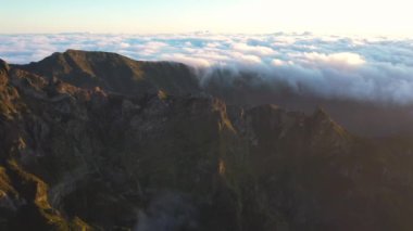 Great aerial footage in 4K over the Pico do Areeiro at a great sunrise with an epic sea of clouds.