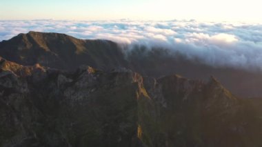 Great aerial footage in 4K over the Pico do Areeiro at a great sunrise with an epic sea of clouds.