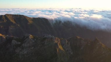 Great aerial footage in 4K over the Pico do Areeiro at a great sunrise with an epic sea of clouds.