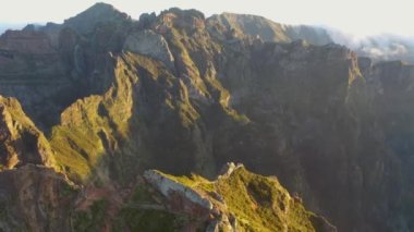 Amazing 4K aerial footage over the Ninho da Manta viewpoint in the Madeira mountains above Funchal during the golden hour.