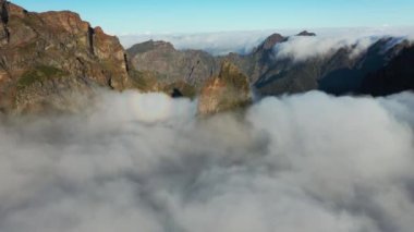 Great aerial footage in 4K in the mountains of Madeira with a mystical atmosphere as the fog comes over the mountain ranges.