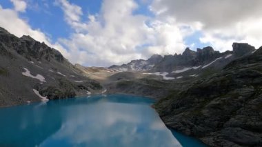 Amazing time lapse at a beautiful alpine lake in the alps of Switzerland. Wonderful video in 4K at an amazing region called Pizol at sunset.