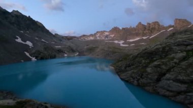 Amazing time lapse at a beautiful alpine lake in the alps of Switzerland. Wonderful video in 4K at an amazing region called Pizol at sunset.