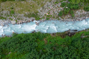 Amazing shot of a beautiful landscape in the alps of Switzerland. Wonderful flight with a drone over an amazing landscape in the canton of Bern. Epic view over a river.