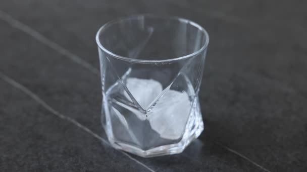 Single Malt Scotch Whiskey Poured Glass Ice Cubes Slow Motion — Stock video