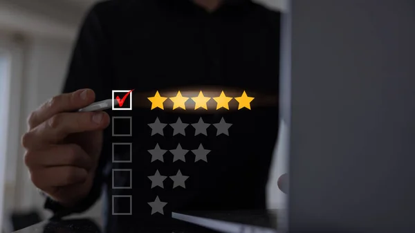 Close up of man customer giving a five star rating on smartphone. Using technology for Review, Service rating, satisfaction, Customer service experience and satisfaction survey concept.