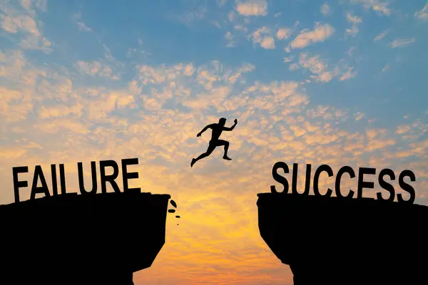 Man jump across text failure to success over cliff on sunset background concept for being successful in job and business.