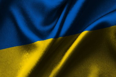 Ukrayna 'nın renkli bayrağını sallıyor. Makro atış. Ücretsiz Ukrayna.