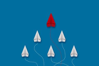 Liderlik konsepti, kırmızı lider uçağı mavi arka planda, beyaz uçağa liderlik ediyor..