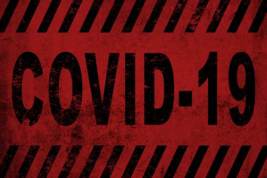 Kaba kırmızı ve pembe duvardaki yazı Covid 19.