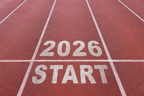 New year 2026 written on the road in the middle of athletics track as a start. Concept of planning