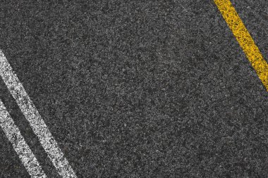 Çift Sarı çizgi üzerinde yeni asfalt yol doku arka plan