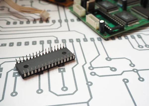 32 pins integrated circuit on the electronic PCB diagram. Printed circuit board background.