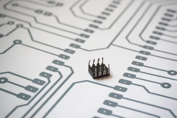 8 pins integrated circuit. Semiconductor component on an electronic printed circuit schema background.