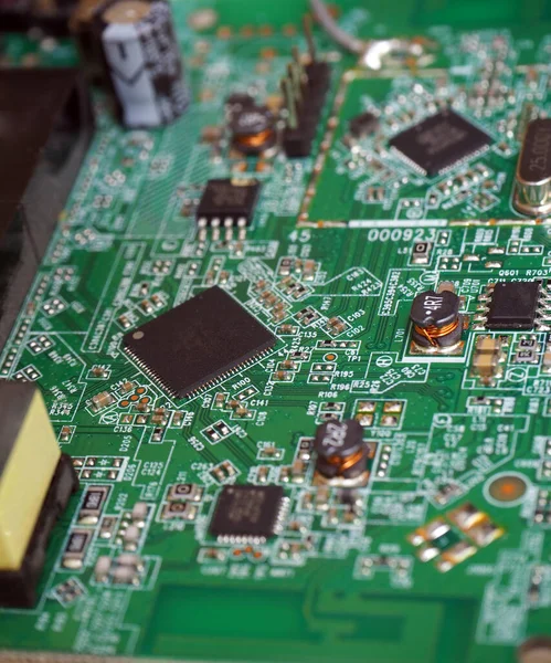 Surface-mount components on printed circuit board. Electronic industry background.