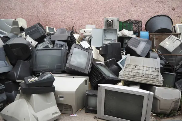 stock image Electronic waste. Out of use monitors and televisions. Recycling industry. Mixed-plastic waste in electronics.