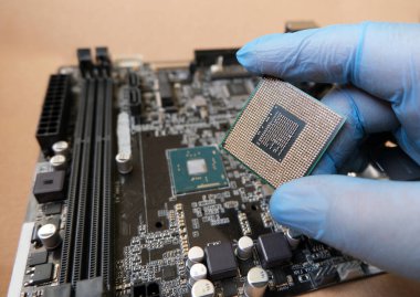 On board CPU and socketed CPU. Microprocessors on the computer mainboard. Selected focus.  clipart