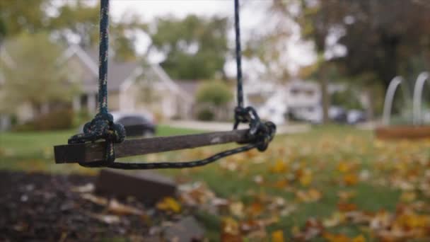 Lone Childrens Swing Neighborhood Playground — Stock Video