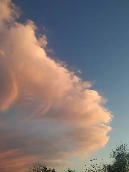 Clouds in the blue sky. Sunset in the sky