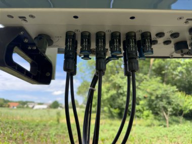 Input of cables to the solar inverter. Connecting the cables to the solar inverter. Solar inverter hybrid isometric system controller with switch. Connecting the hybrid inverter to the panels clipart