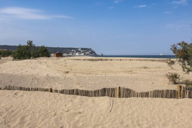 Costa Brava beach with L'Estartit village in the background. clipart