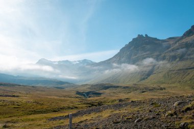 View of surrounding mountains on a sunny day at Kirkjufell, Iceland