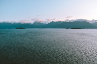 Pink clouds on the horizon of Glacier Bay, Alaska