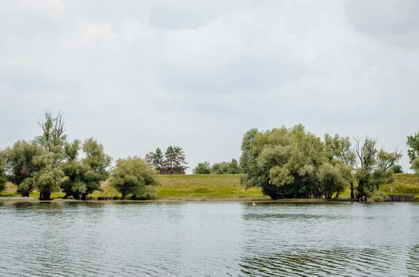A panoramic view of the constructed artificial lake. A panoramic view of the constructed artificial lake, in the summer period of the year.