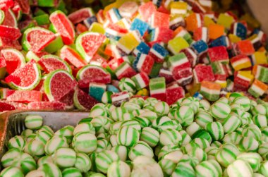 Sweet and sugar colorful candies in the shop for background.