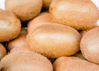 Kiwi fruits on the market. A bunch of fresh kiwi fruits being sold on the market.