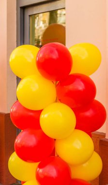 Red and yellow intertwined balloons.